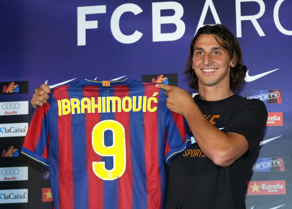 Zlatan Ibrahimovic holding up Barcelona shirt