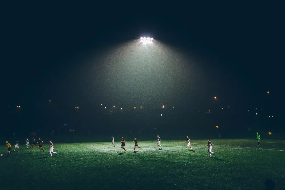 Players in the on a dark football field